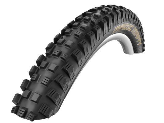 Black off-road tire with tread pattern on a white background