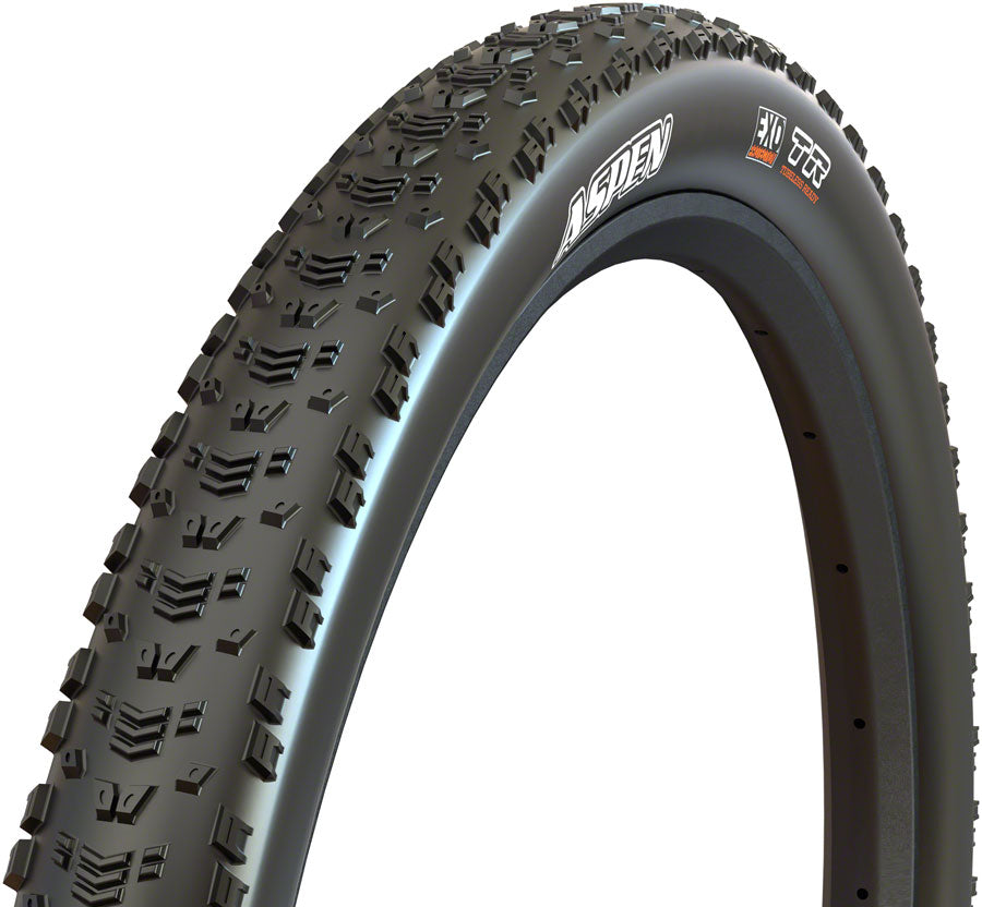 Close-up of a bicycle tire with tread pattern and brand logo on a white background