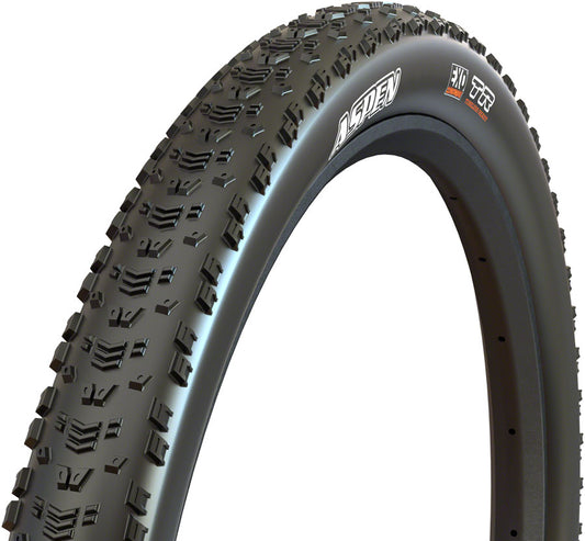 Close-up of a bicycle tire with tread pattern and brand logo on a white background