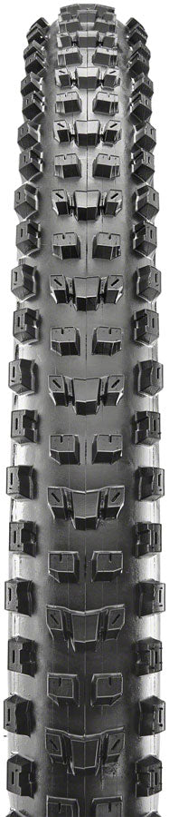 Close-up of a tire tread pattern with deep grooves and sipes