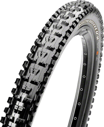 Bicycle tire with knobby tread pattern on a white background