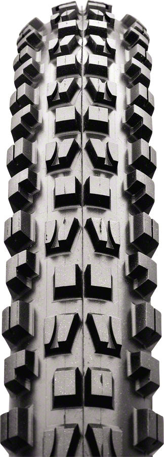 Close-up of a tire tread pattern with prominent knobs