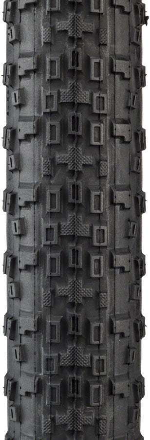 Tire with knobby tread pattern on a white background