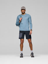 Load image into Gallery viewer, Man wearing athletic clothing with a gray cap on a light gray background
