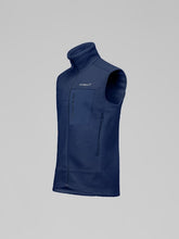 Load image into Gallery viewer, Blue vest with a brand logo on a gray background
