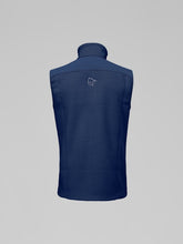 Load image into Gallery viewer, Navy blue vest with a logo on the back against a gray background
