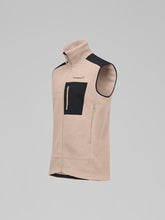 Load image into Gallery viewer, Beige fleece vest with black accents on a gray background
