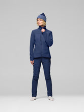 Load image into Gallery viewer, Person wearing a blue jacket and pants with a matching beanie on a gray background
