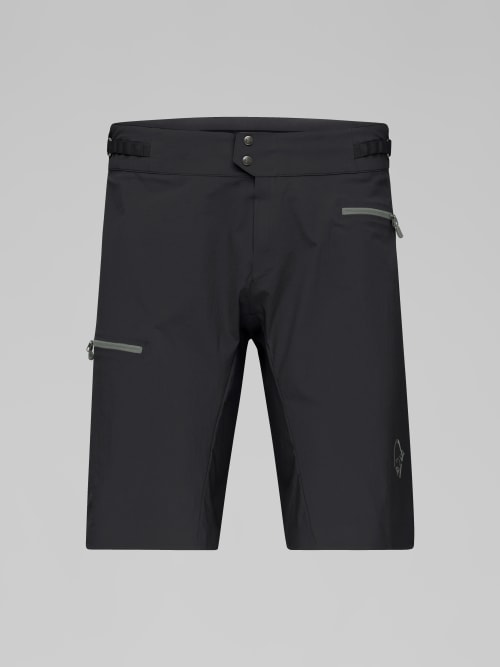Black shorts with zippers on a gray background