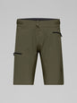 Green shorts with black zippers on a gray background