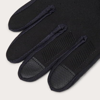 Black slippers with textured soles on a light gray background