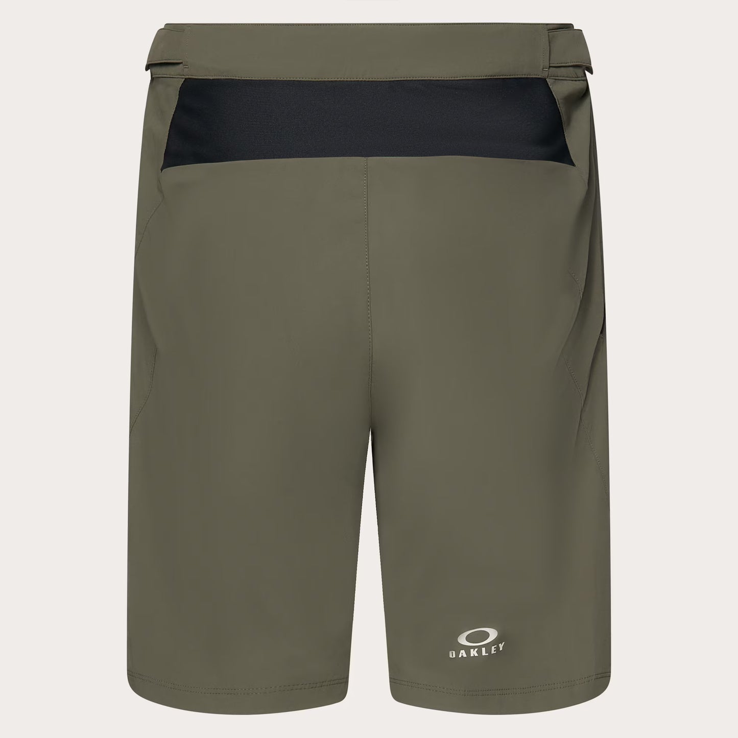 Olive green Oakley athletic shorts with a black contrast waistband panel and a small white Oakley logo near the lower left leg, shown on a light gray background.