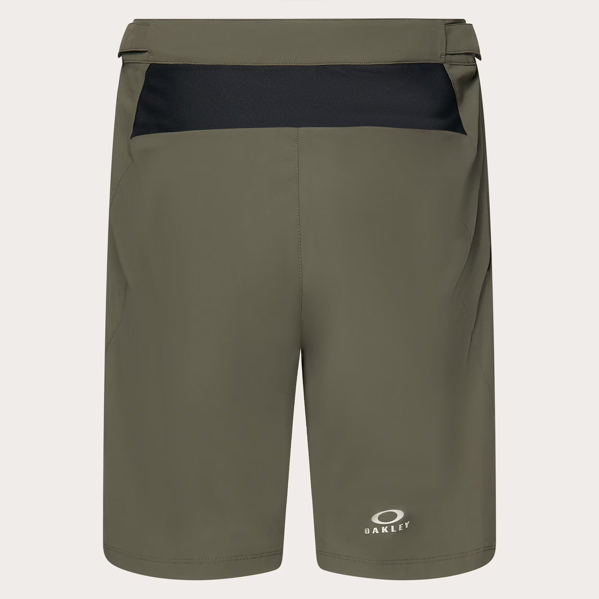 Olive green Oakley athletic shorts with a black contrast waistband panel and a small white Oakley logo near the lower left leg, shown on a light gray background.