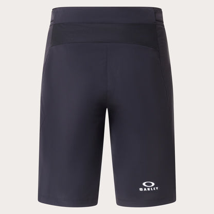 Dark navy athletic shorts with a white Oakley logo on the lower left leg, shown against a light beige background.