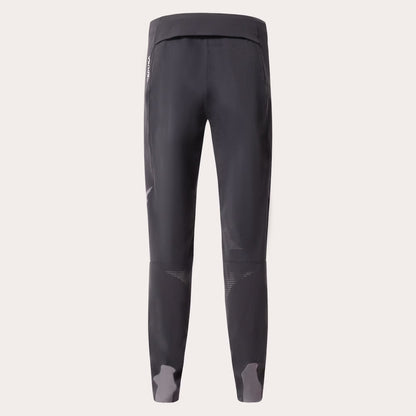 Dark gray athletic leggings shown from the back on a light beige background.