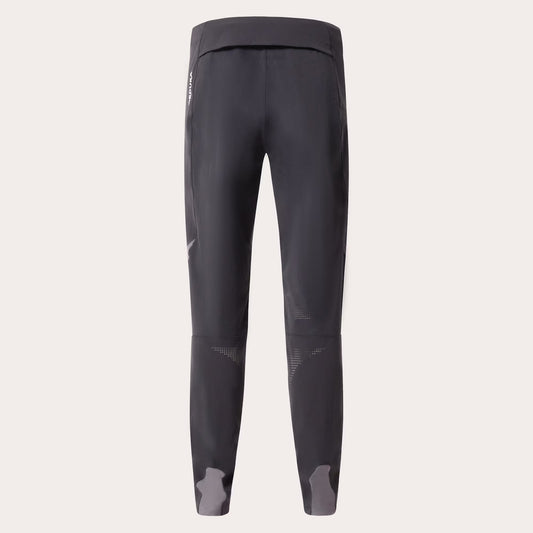 Dark gray athletic leggings shown from the back on a light beige background.