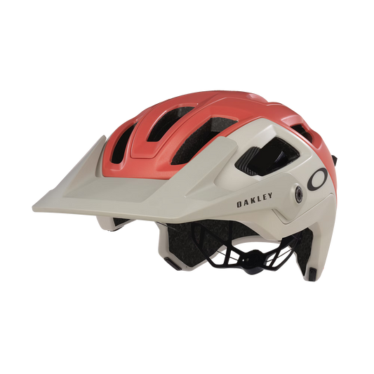 Red and beige helmet with 'Oakley' branding on a white background