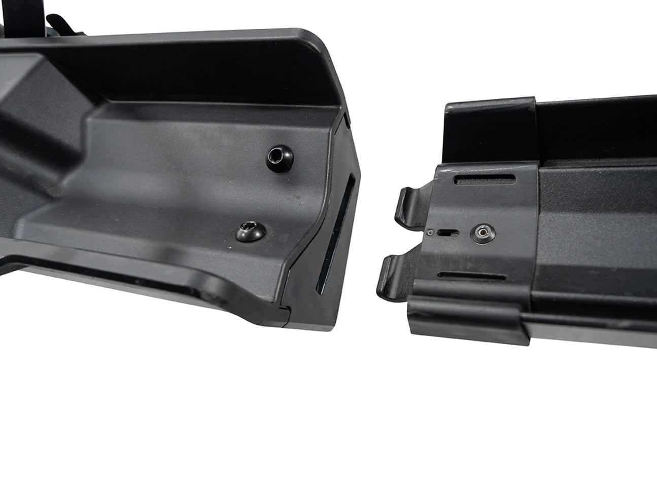 Close-up of a black metal bracket on a white background