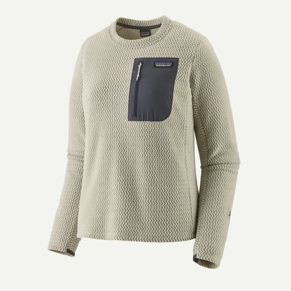 Beige sweater with a blue pocket on a white background