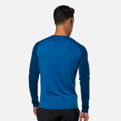 Person wearing a blue long-sleeve shirt on a white background