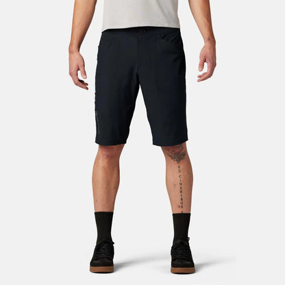 Person wearing black shorts on a white background