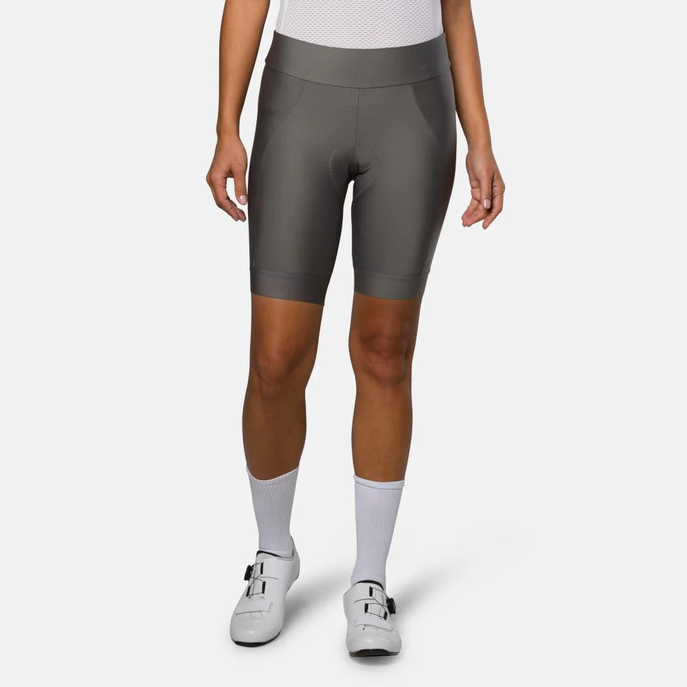 Person wearing gray athletic shorts on a white background