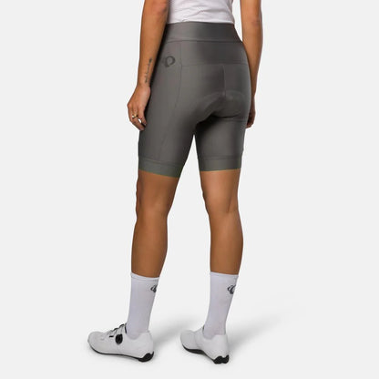 Person wearing gray cycling shorts on a white background