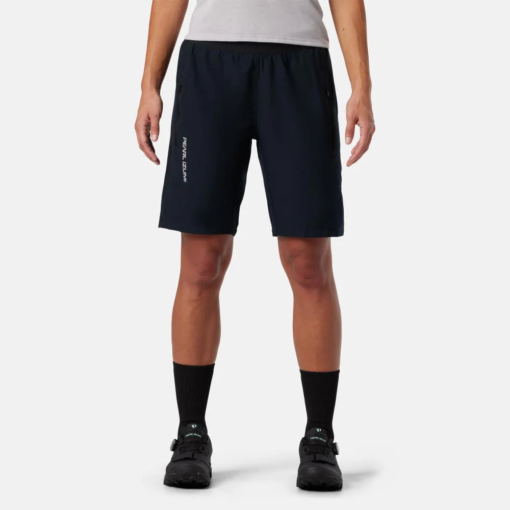 Person wearing black athletic shorts on a white background