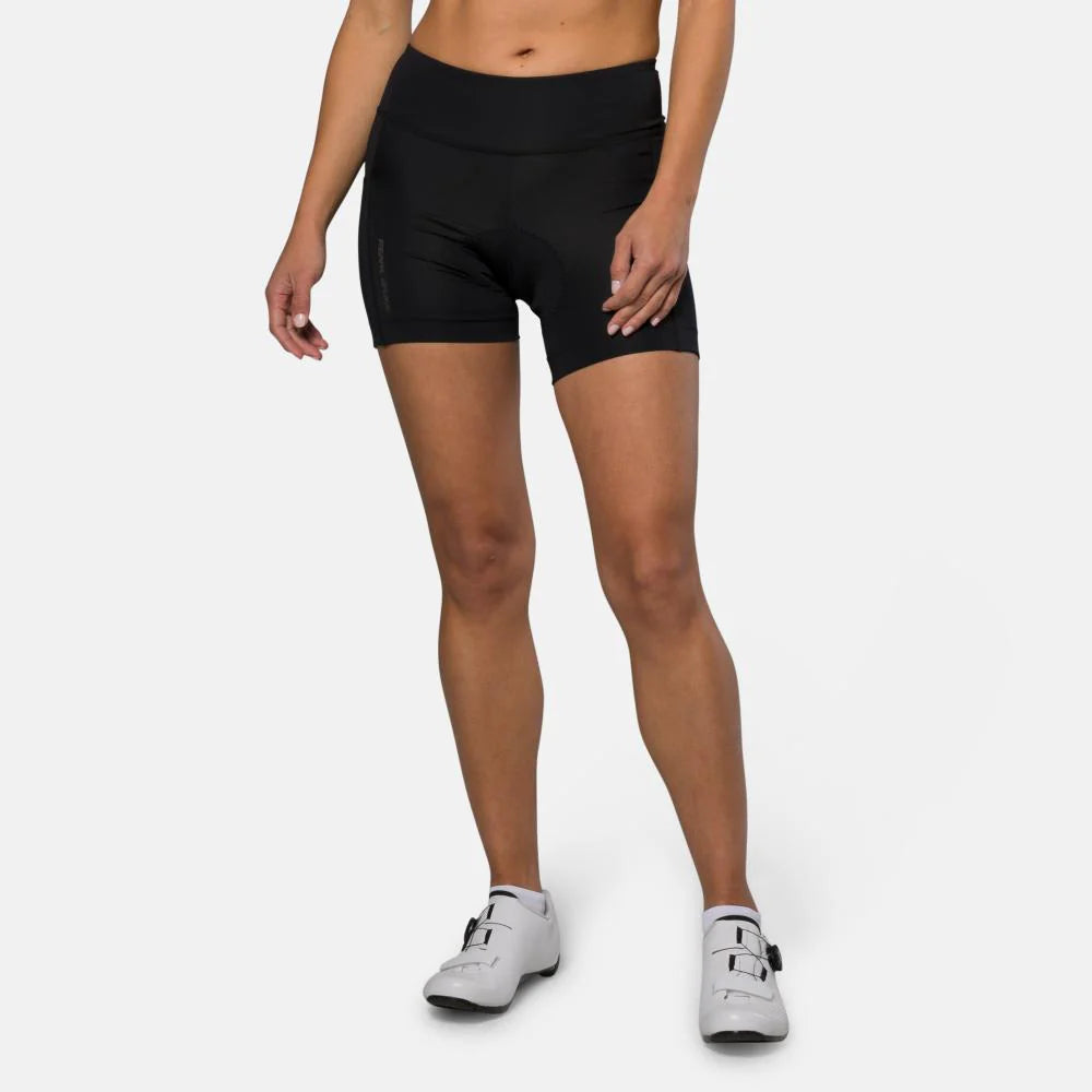 Person wearing black athletic shorts on a white background