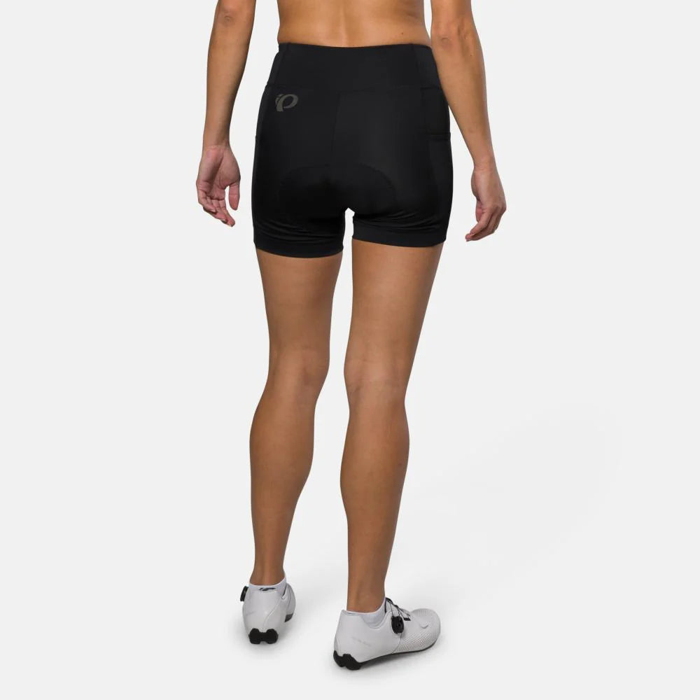 Person wearing black cycling shorts on a white background