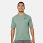 Man wearing a green athletic shirt with a logo on a white background