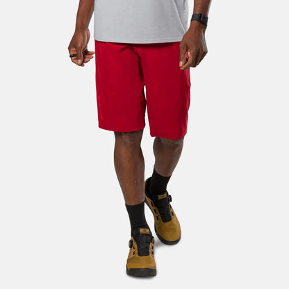 Person wearing red shorts and brown shoes on a white background