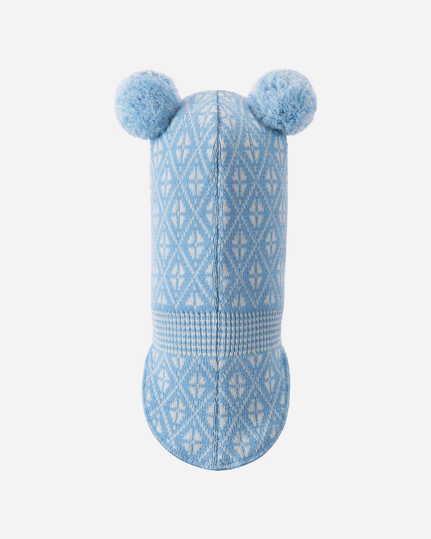 Blue knitted dog toy with pom-poms on a white background