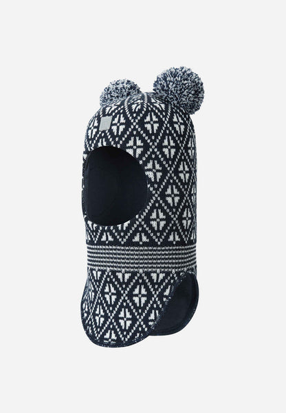 Knitted beanie with pattern and pom-poms on a white background