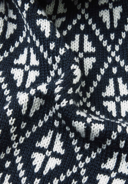 Close-up of a navy blue fabric with white geometric pattern