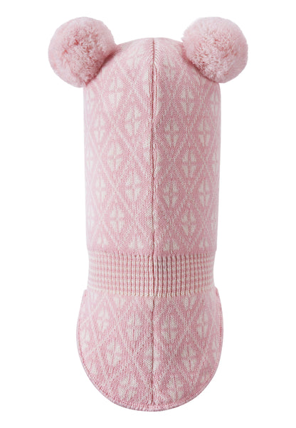 Pink knitted baby hat with pom-poms on a white background