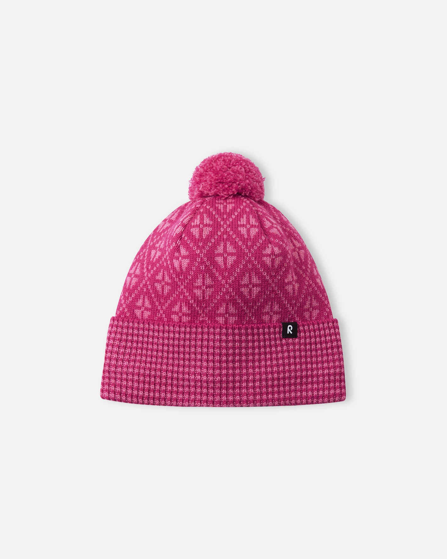Pink patterned beanie with a pom-pom on a white background