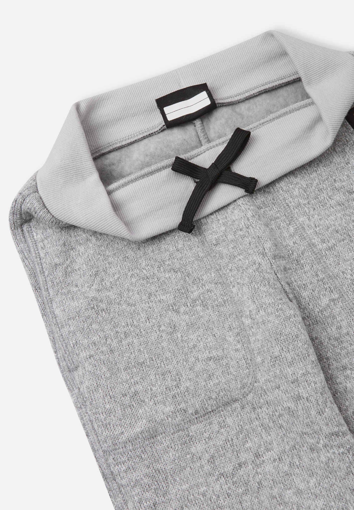 Gray pants with a brand label on a white background