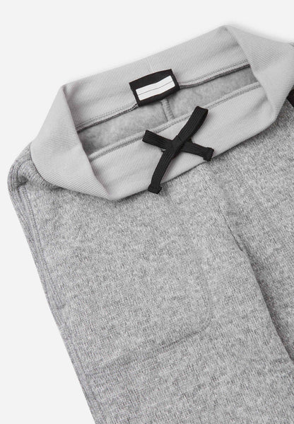 Gray pants with a brand label on a white background