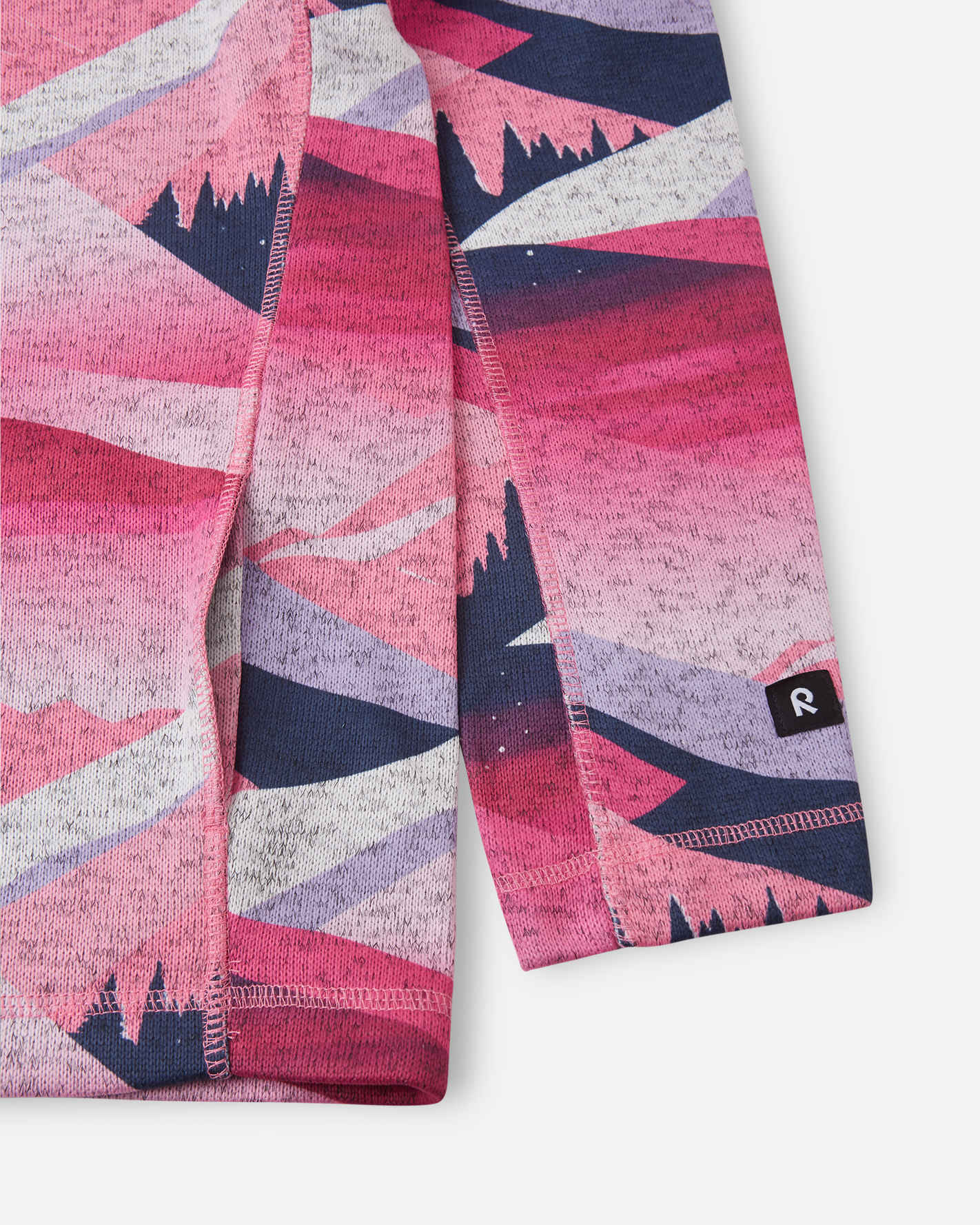 Folded pink and purple patterned leggings with a brand logo on a white background