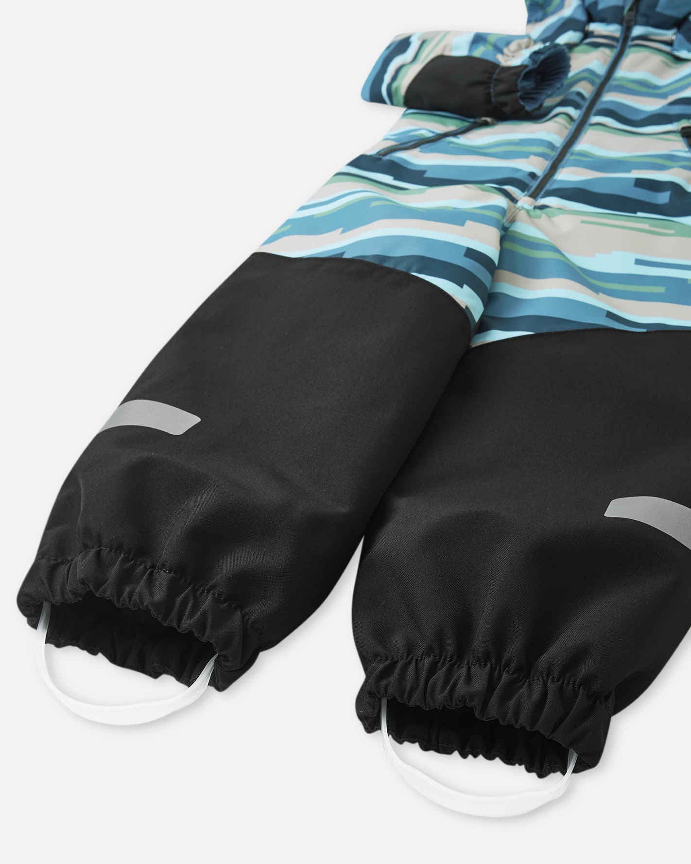 Close-up of black gloves with a colorful striped jacket on a white background