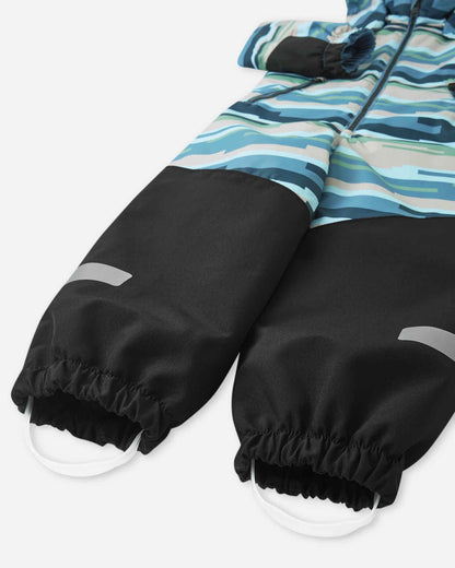 Close-up of black gloves with a colorful striped jacket on a white background