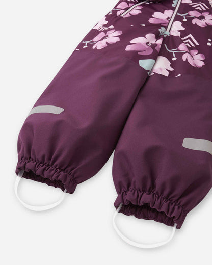 Purple children's pants with floral pattern on a white background