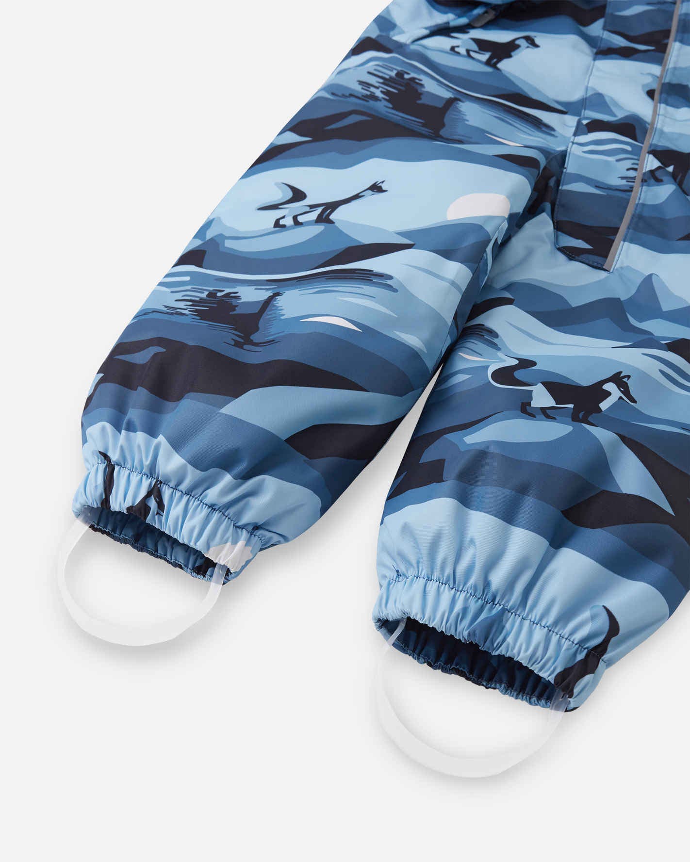 Blue camouflage-patterned snow pants on a white background