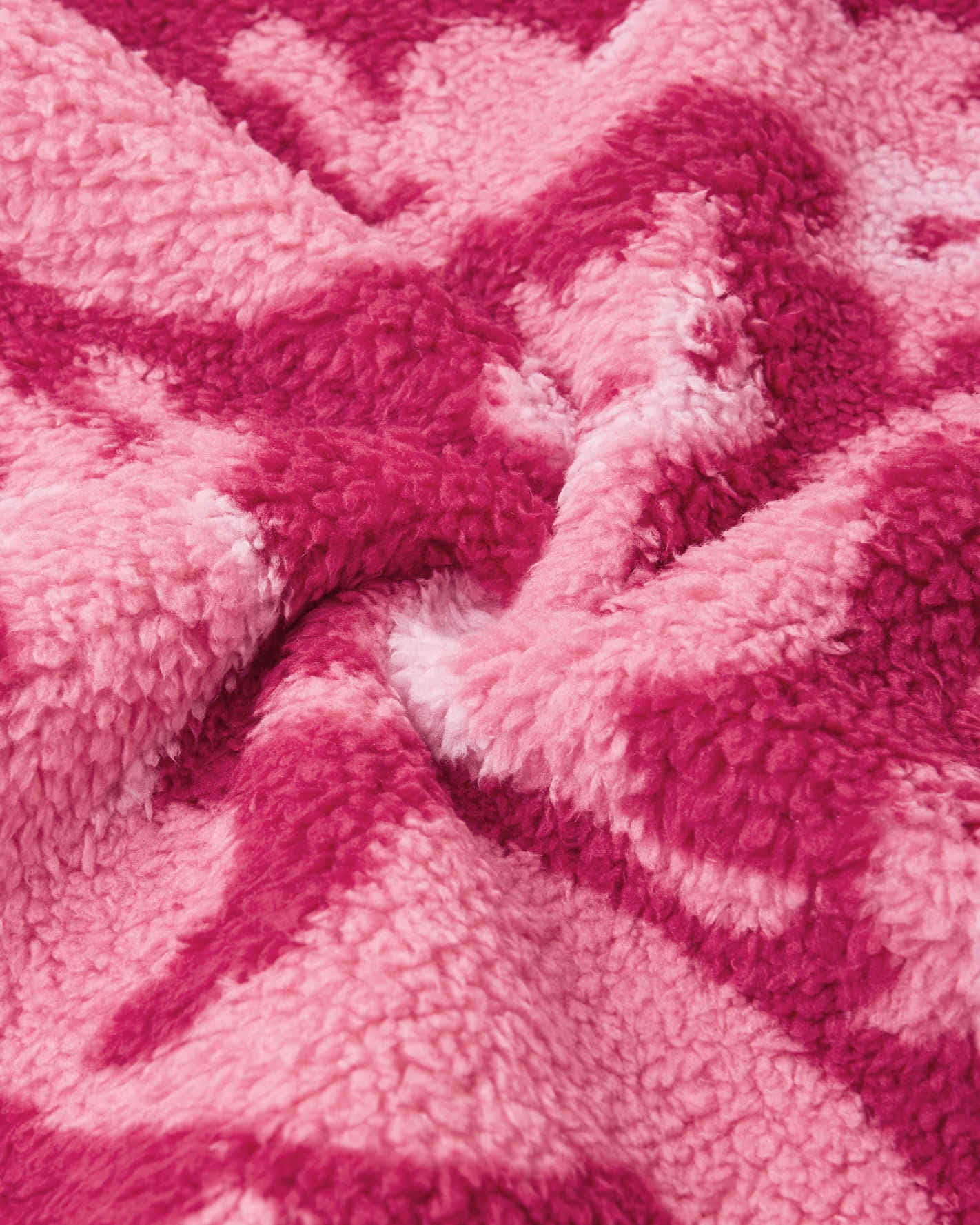 Close-up of pink textured fabric with a wavy pattern