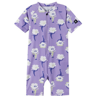 Purple children's swimsuit with floral pattern on a white background