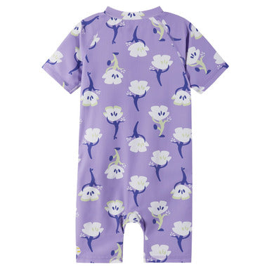 Purple children's outfit with floral pattern on a white background
