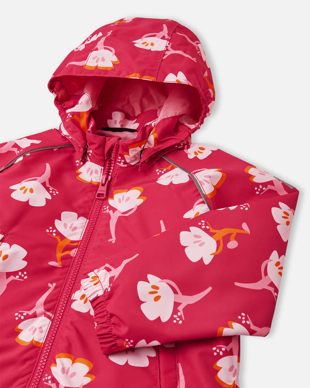 Pink children's raincoat with floral pattern on a white background