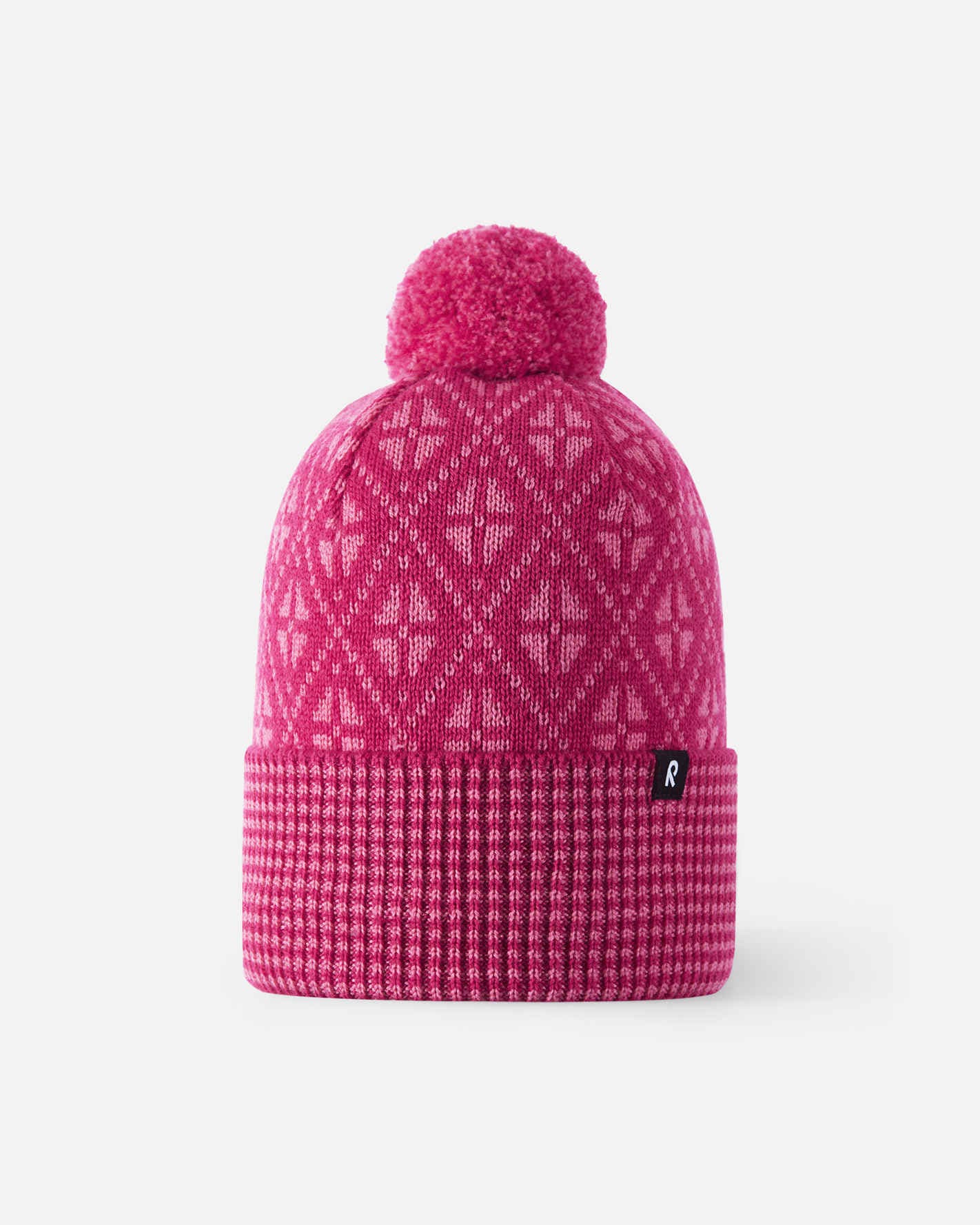 Pink knit beanie with a pom-pom on a white background