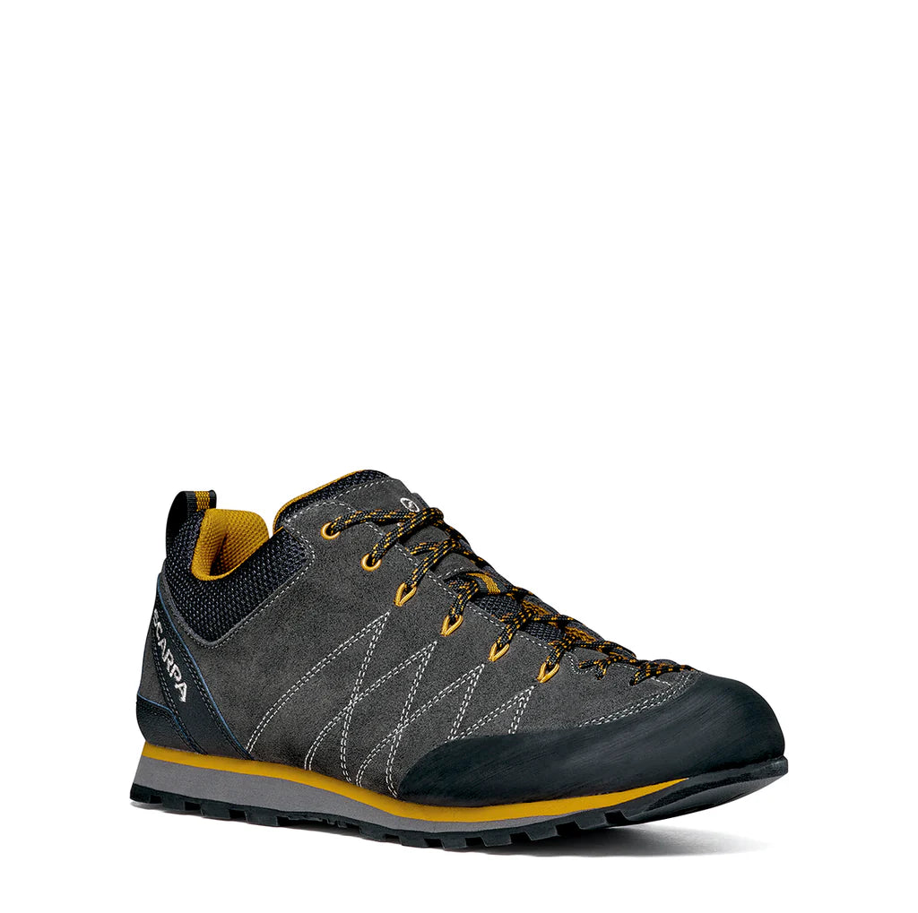 Gray and yellow hiking shoe on a white background